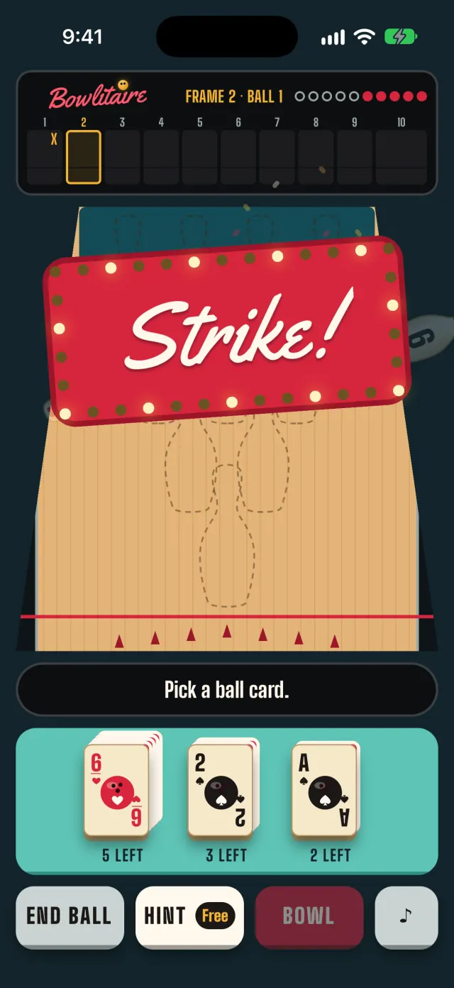 A full game in the app: the Strike! marquee over the lane after all ten pins fell on the first ball, with an X in frame 1 on the score board.
